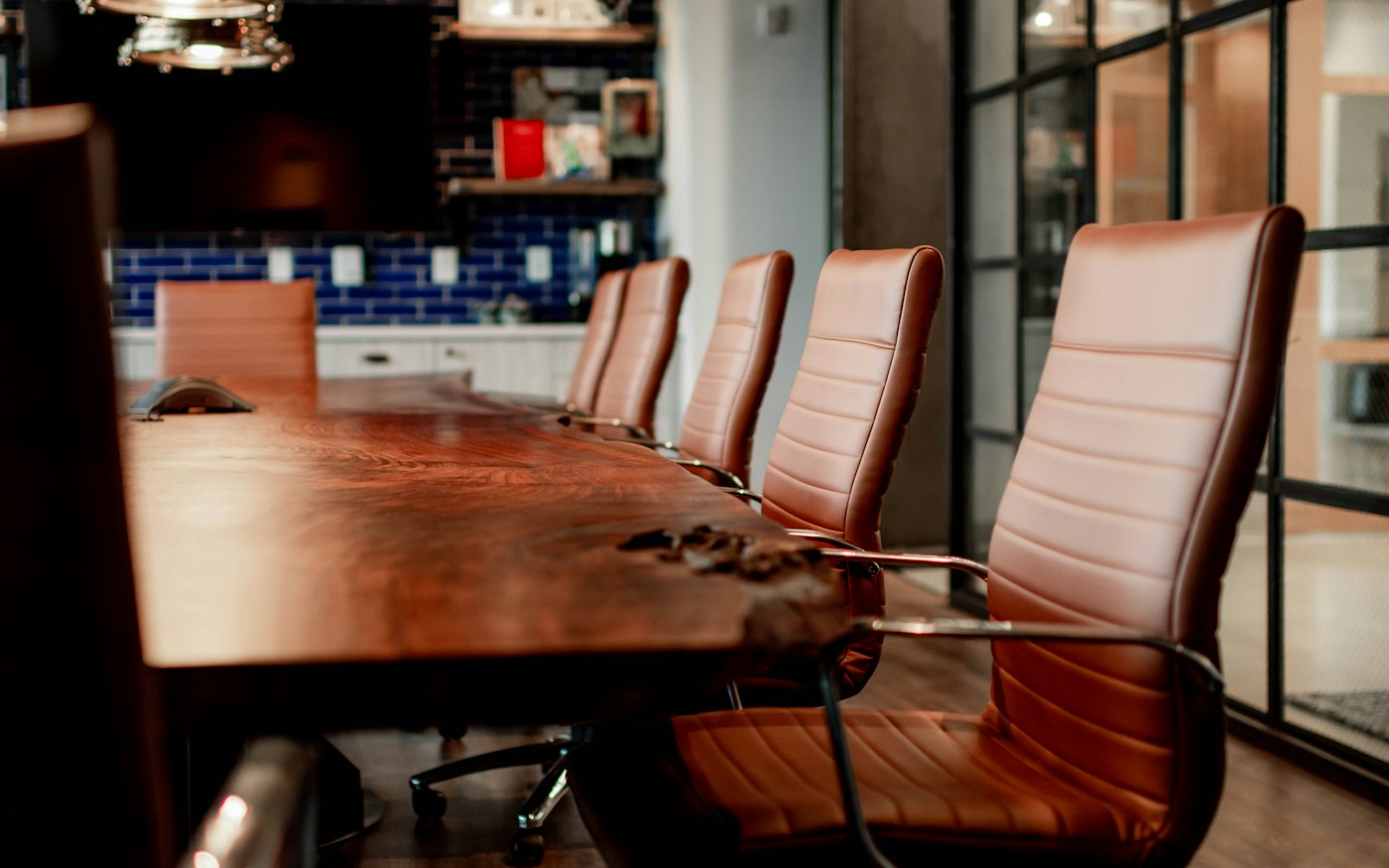 Empty executive conference room with wooden table