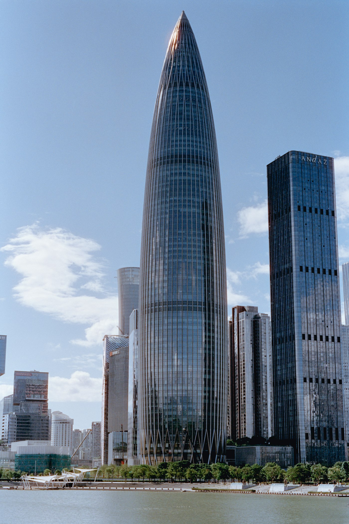 Modern glass skyscrapers against a blue sky